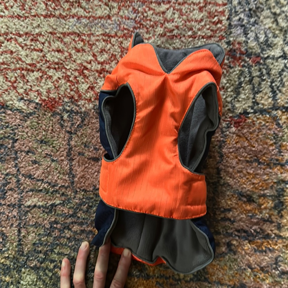 Eddie Bauer XS dog coat. Orange and blue adjustable Velcro closure.